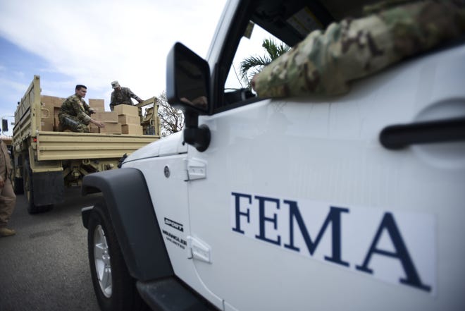 Department of Homeland Security personnel deliver supplies to Santa Ana community residents in the aftermath of Hurricane Maria in Guayama, Puerto Rico, on Oct. 5. Republicans and Democrats in Congress are pushing to exempt Puerto Rico from a federal law that prohibits foreign-flagged ships from shuttling goods between U.S. ports. President Donald Trump temporarily waived the Jones Act last month amid criticism that the once-obscure law hindered relief efforts to in Puerto Rico following Hurricane Maria. The 10-day waiver expired on Sunday night and was not renewed. A spokesman for the Department of Homeland Security said an extension was not needed to support relief efforts on the island, adding that there's "an ample supply" of U.S.-flagged vessels to ensure cargo reaches Puerto Rico. [Carlos Giusti/AP FILE PHOTO]