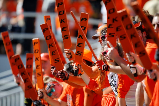 File: Oklahoma State fans wait for the start of a college football game in Stillwater, Okla. [ The Oklahoman archives]