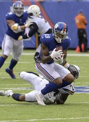 The loss of Giants star wide receiver Odell Beckham will take some steam out of tonight's prime time matchup between the Broncos and the winless Giants. [AP Photo/Bill Kostroun]