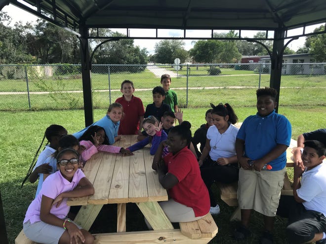Eustis Heights students enjoy the new picnic pavilion donated by Lowe's. [SUBMITTED]