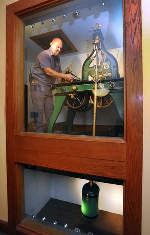TIMES-REPORTER PAT BURK

Jack Hupp, maintenance supervisor for Tuscarawas County, oils the 1888 Seth Thomas clockworks, that control the clockfaces and hands, as well as the counterweights weighing hundreds of pounds each, in the Tuscarawas County Courthouse in New Philadelphia.