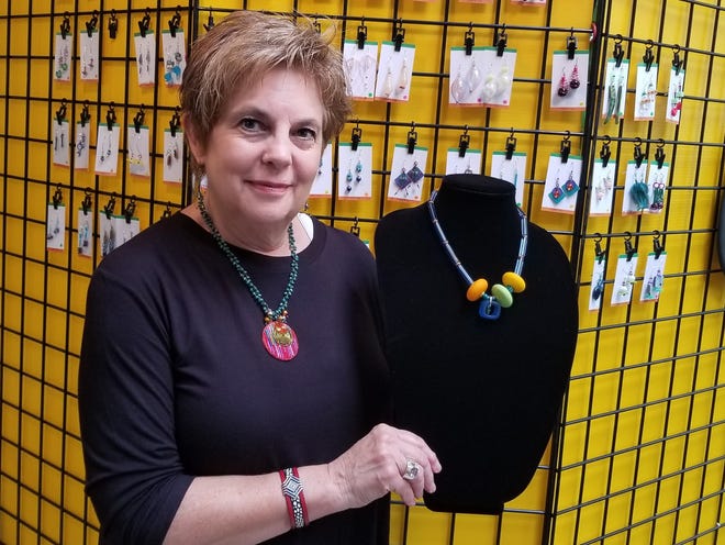 Jewelry designer Len Curran displays her work at the Allegany Artisans studio tour on Sunday in Alfred Station. Curran began making eclectic necklaces, bracelets and earrings when she was given an earring kit by a friend. (MADONNA FIGURA SIMON PHOTO)