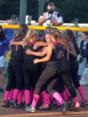 Mount Holly Middle School celebrate their championship at the end of the Gaston County Middle School softball championship game held Monday afternoon, Oct. 16, 2017 at Mount Holly Middle School. [Mike Hensdill/The Gaston Gazette]