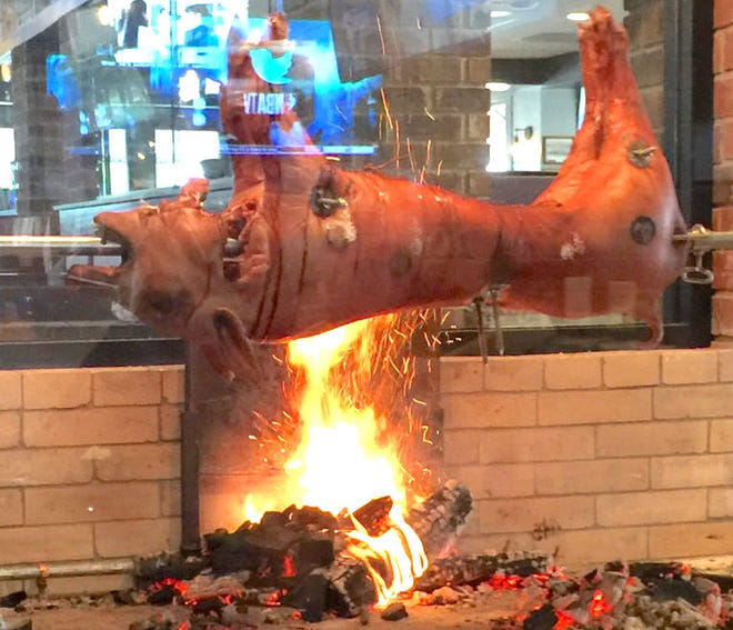 Donaldsonville native Chef John Folse collaborated with TJ Ribs to create this cochon de lait pit at the South Acadian Thruway location.