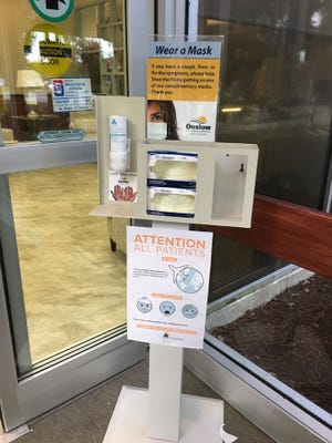 Complimentary handwashing stations with masks and tissues can be found around Onslow Memorial Hospital to held prevent spread of the flu. [photo contributed]