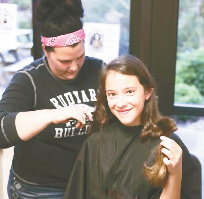 Lucy Lalone, 6th grader at Rudyard, donated 8 inches of her hair to Children with Hair Loss, a Michigan-based organization. "If feels weird being short, but I wanted to help those with cancer," said Lucy.