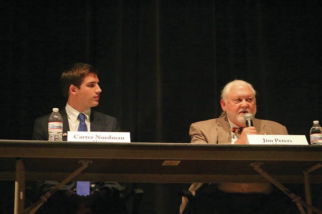 Mayor Jim Peters (right) responds to a question as Carter Nordman listens. The Adel City Candidate Forum was hosted by the Adel Partners Chamber of Commerce in the A-D-M Middle School/High School Auditorium on Monday. PHOTO BY CLINT COLE/DALLAS COUNTY NEWS