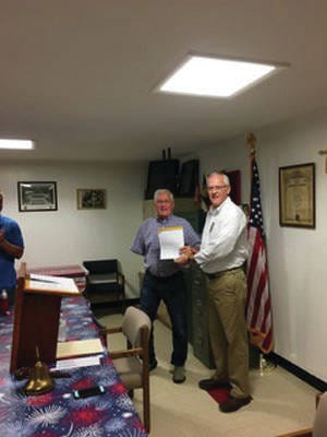 Bill Sandquist (left) is honored by Adel Lions Club President, Rich Hughes (right) for 55 years with the Lions Club. PHOTO SUBMITTED TO DCN