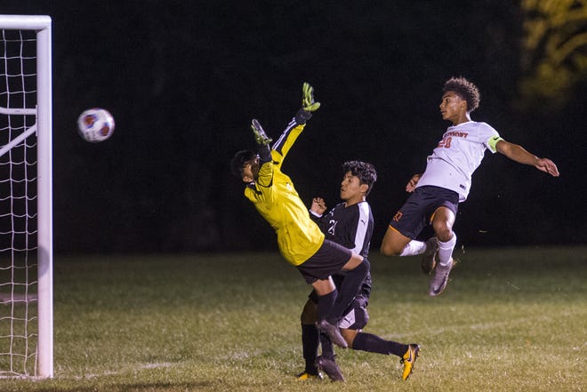 Freeport's Isaiah Field, right, watches his header go past the Harvard defense for a goal with 6:06 left in the second period on Tuesday, Oct. 17, 2017, during the Class 2A regional semifinals in Harvard. [ARTURO FERNANDEZ/THE JOURNAL-STANDARD STAFF]