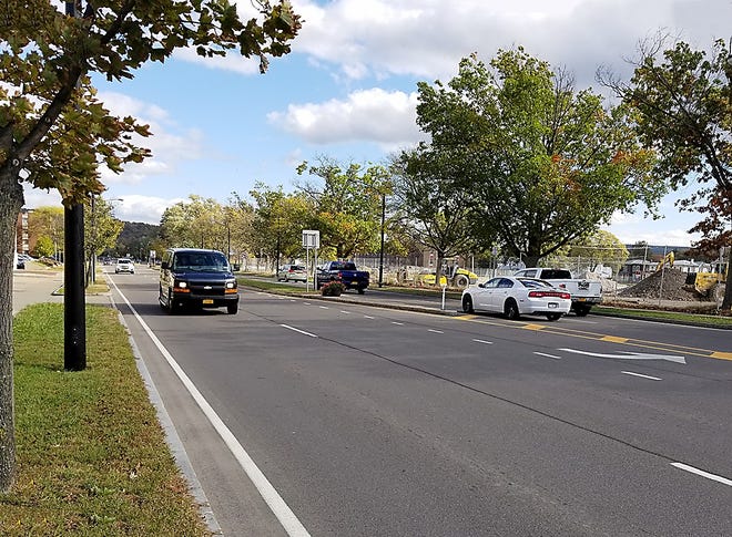 Vehicles drive down Denison Parkway (State Route 352) Monday afternoon in Corning. [James Post/The Leader]