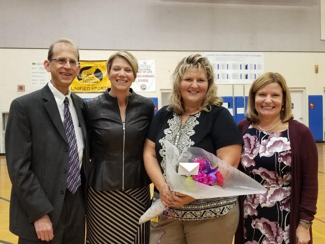 Jack Jackter Intermediate School paraeducator Karen Mylly, third from left, was recognized Monday with the 2018 Anne Marie Murphy Paraeducator of the Year award. With her are Colchester Board of Education Chairman Ronald Goldstein, left, JJIS Principal Elise Butson and interim Superintendent Karen Loiselle Goodwin