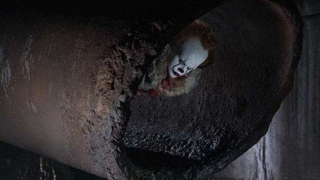 Watch out for Pennywise the clown in “It.” Contributed by New Line Cinema