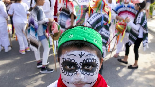 Juan Contreras, 9, lines up for the Día de los Muertos parade at the Viva La Vida Festival in downtown Austin in 2016. Austin’s largest and longest-running Day of the Dead event, produced by the Mexic-Arte Museum, also featured a street festival with artist vendors, live music, food trucks, art activities and community altars. JAY JANNER / AMERICAN-STATESMAN