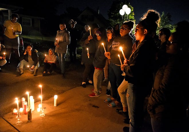 A candlelight vigil was held Monday outside a house on Bermuda Circle in Willingboro, where India Simeon, 17, of Pemberton Township, was killed Saturday evening. [NANCY ROKOS / STAFF PHOTOJOURNALIST]