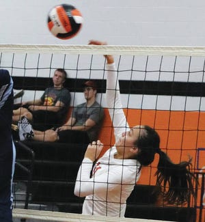 Kyra Troendle delivers a spike Tuesday in Madrid’s volleyball win over Panorama. Troendle ended up with two kills as the Tigers advanced to the second round of a Class 2-A Region. Photo by Andrew Logue/News-Republican