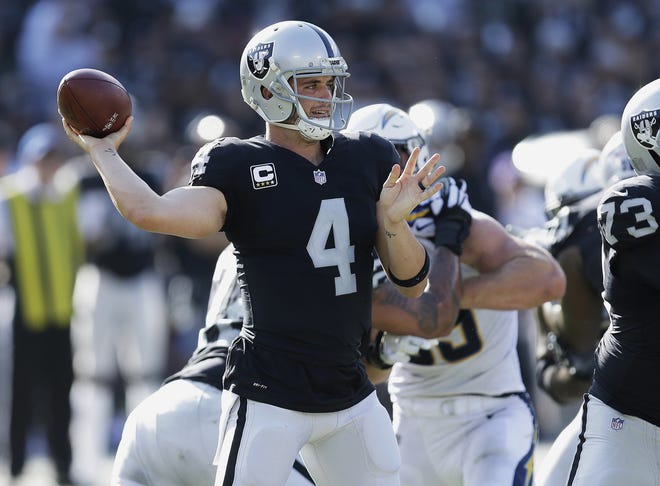 Oakland Raiders quarterback Derek Carr threw for just 171 yards, a touchdown and two interceptions Sunday against the Chargers. [Ben Margot/The Associated Press]