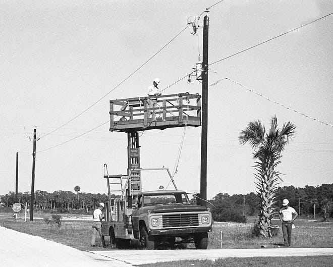 Workers install streetlights in Palm Coast in March 1979. ITT Community Development Corp. began to develop what would become Palm Coast in 1969. Ten subsidiary companies were formed expressly to purchase the 68,000 acres from 35 major landowners. Among those owners were ITT Rayonier, Wadsworth Land Company and Lehigh Cement Company. [Flagtler County Historical Society]