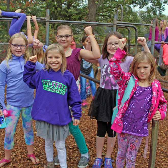 Dressed in purple, Jefferson Elementary students show off their muscles, ready to fight cancer Friday.



CHRISTY HART-HARRIS PHOTO