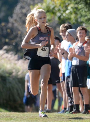 NORWICH 10-18-2017 AARON FLAUM: Montville's Mady Whittaker faces tot he finish line of the Girls Eastern Connecticut Conference Cross Country Championships at the Norwich Golf Course. Whittaker won with a time of 20:25.

[Aaron Flaum/NorwichBulletin.com]