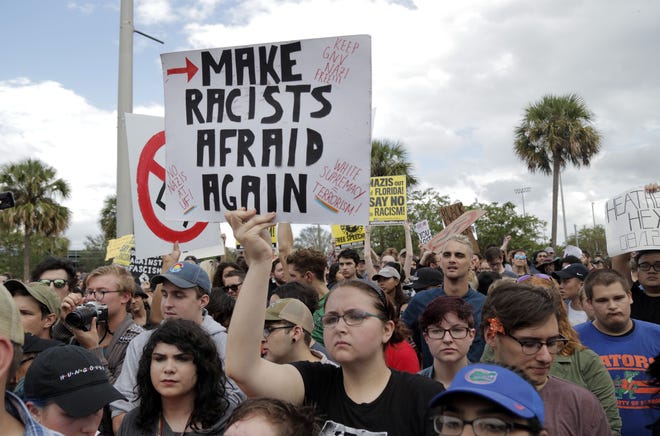 Protesters march against white nationalist Richard Spencer before his speech at the University of Florida on Thursday. [Kaila Jones/Correspondent]