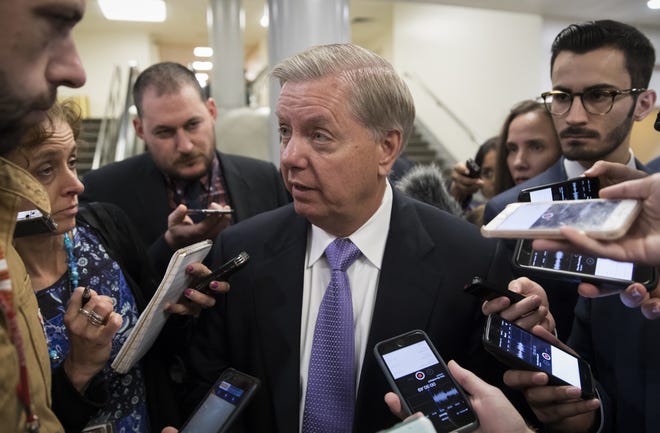 Sen. Lindsey Graham, R-S.C., chairman of the Senate Subcommittee on Crime and Terrorism, is questioned by reporters during votes, at the Capitol in Washington, Thursday, Oct. 19, 2017. (AP Photo/J. Scott Applewhite)