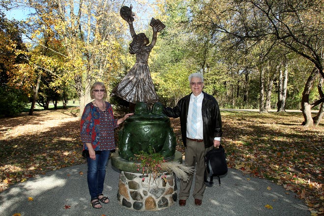 Linda Vietmeyer, left, and Taun Nimmo stand next to the "Annie's Adventure" statue unveiled Wednesday, Oct. 18, 2017, in the Commissioner's Garden at Krape Park in Freeport. The statue was designed by Vietmeyer to honor Anna Belle Nimmo, who donated to the Freeport Parks Foundation, which paid for the statue in Anna's honor. [JANE LETHLEAN/THE JOURNAL-STANDARD CORRESPONDENT]