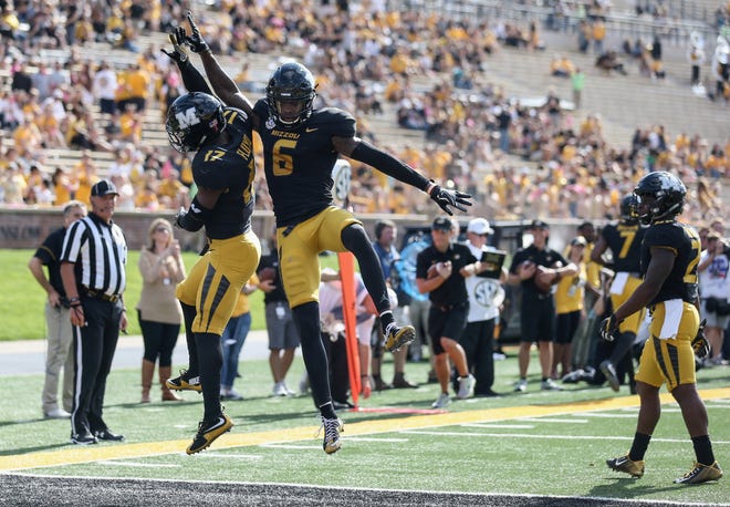 Missouri wide receiver Richaud Floyd (17) celebrates with wide receiver J'Mon Moore (6) after Floyd scored on an 18-yard reception in the third quarter of the Tigers' 68-21 victory over Idaho on Saturday at Faurot Field. [Timothy Tai/Tribune]