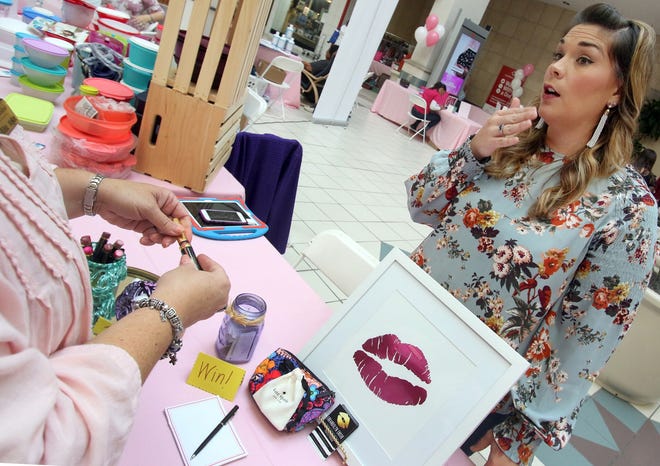 Brandolyn Ensor, with Perfect Pucker, talks about lipsense during the 2017 Women's Expo held inside the Eastridge Mall Saturday, Oct. 21, 2017. [Mike Hensdill/The Gaston Gazette]