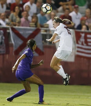 Alabama midfielder Hailey Brohaugh (15) heads a ball away from an LSU player during a game in Tuscaloosa earlier this season. Alabama plays its final home game of the season Sunday. [Staff Photo/Gary Cosby Jr.]