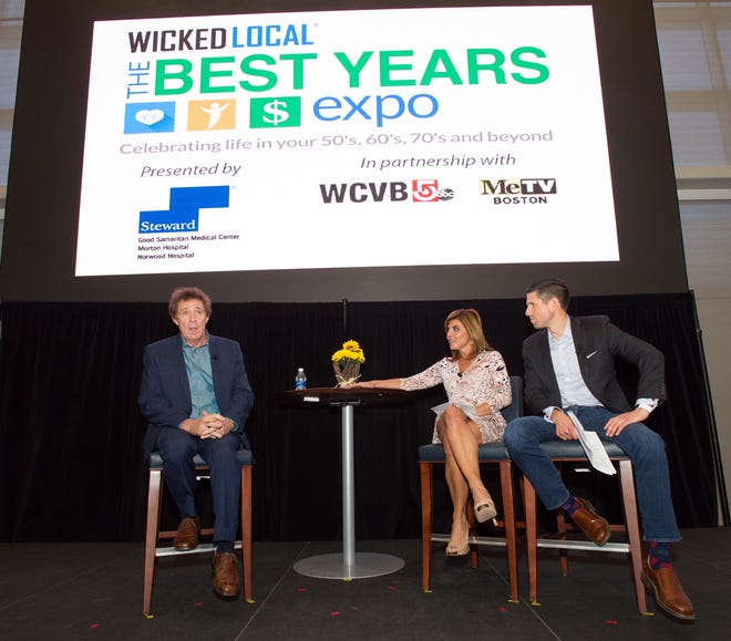 Barry Williams, left, takes the stage with Maria Stephanos and Ben Simmoneau from WCVB during the third annual "The Best Years Expo" presented by Steward Health Care at Gillette Stadium in Foxboro on Saturday. [Wicked Local Photo/James Jesson]