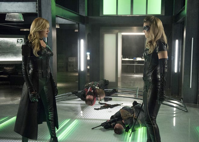 Laurel Lance/Black Siren (Katie Cassidy) and Dinah Drake/Black Canary (Juliana Harkavy) square off with their sonic screams in the season premiere of "Arrow." [THE CW NETWORK]