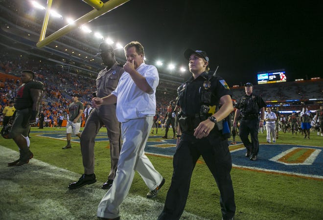 Florida coach Jim McElwain leaves the field after a disappointing 19-17 loss to Texas A&M at Ben Hill Griffin Stadium in Gainesville on Oct. 14. [Alan Youngblood / Gatehouse Media]