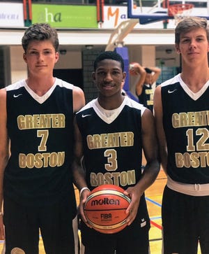 Randolph's Travis Evee of Randolph (center), along with Boston College High School teammates Spencer Riley of Hingham (left) and Troy Salmans of Weymouth, played on the Greater Boston team during a European basketball trip in August. The team went 7-1. [Courtesy photo]