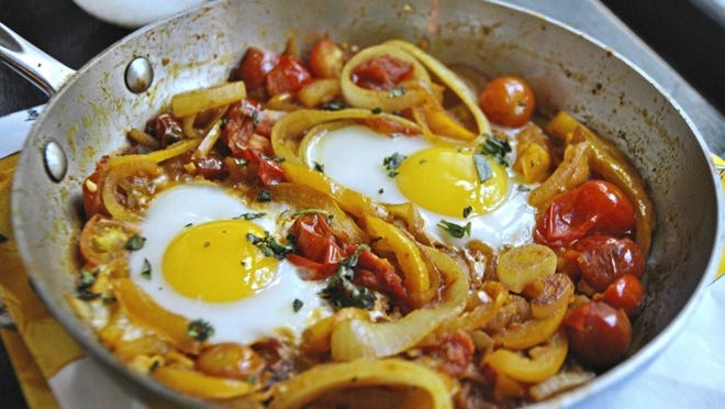 Golden Shakshuka is made with yellow bell peppers and yellow cherry tomatoes. (Gretchen McKay/Pittsburgh Post-Gazette/TNS)