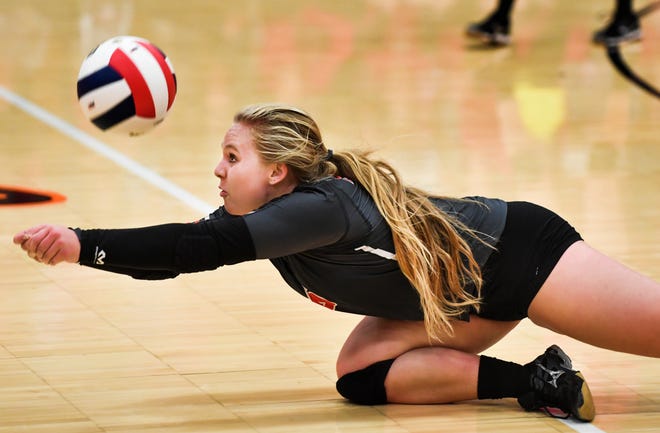 RON JOHNSON/JOURNAL STAR Josi Becker of Morton goes to the floor for a dig during the Class 3A Regional game with Washington on Tuesday.