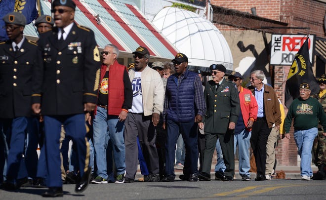 Local veterans march in last year's Salute Veteran's Day parade on Herritage St. in Kinston. File photo