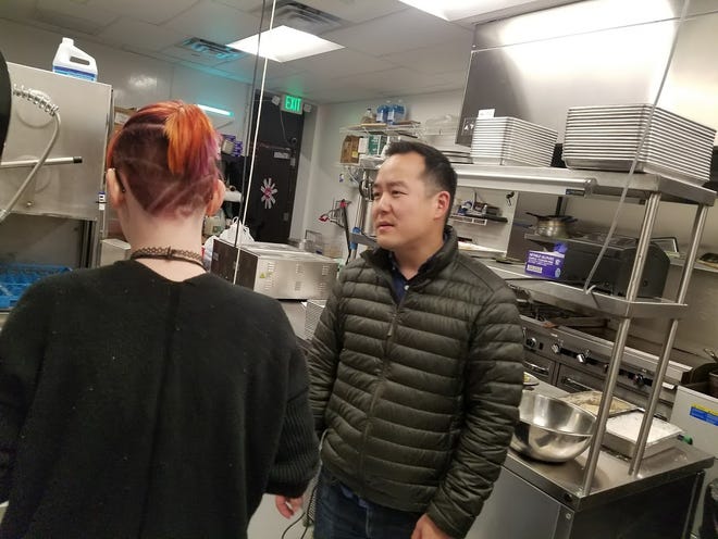 Daniel Chae, owner of Urban restaurant on NW 23 Street, speaks with his kitchen staff. (Photo by Ben Felder, The Oklahoman)