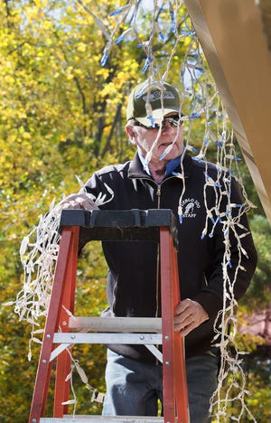 Although the yellow trees at the Pueblo Zoo say it's still October, staff members like Lynn Peterson are busy taking advantage of the beautiful fall weather to set up the annual Electricritters holiday display on Oct. 24, 2017 in Pueblo, Colo. The event that features over 150 lighted animal displays and thousands of lights throughout the zoo grounds will start Thanksgiving week and run on select days through the Christmas season. (Chris McLean, The Pueblo Chieftain)