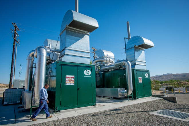 Victor Valley Wastewater Reclamation Authority Lead Mechanic Marcos Avila walks past 2G Biogas CHP Cogeneration Modules used to burn biogas to produce more energy at VVWRA. [Photo courtesy of VVWRA]
