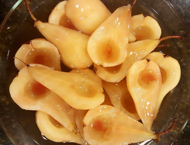 Poaching pears requires some patience, but it's well worth the wait. You can poach a whole pear skinless with the seeds removed, but pear halves poach faster and are easier to can. Whole-poached pears are perfect for dessert presentations. [Submitted]