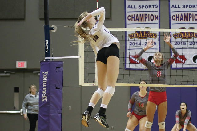 Haley Bush goes up for a kill during the regional semifinal game against Ottumwa on Oct. 24. Bush led the Warriors with 19 kills. PHOTO BY BAILEY FREESTONE/DALLAS COUNTY NEWS