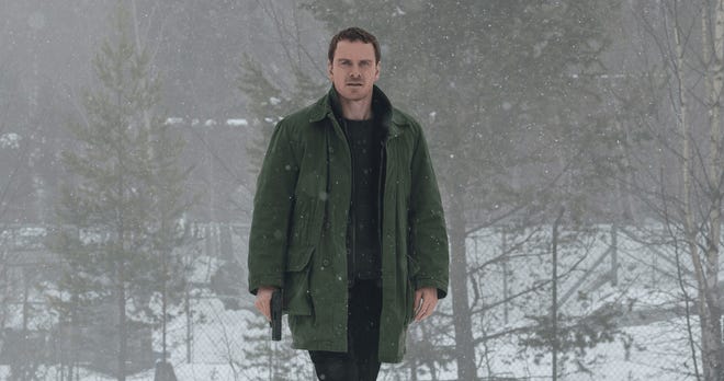 A detective (Michael Fassbender) investigates the disappearance of a woman whose pink scarf is found wrapped around an omnious-looking snowman in 'The Snowman.' [More Content Now]