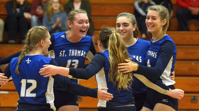 Celebrating a St. Thomas Aquinas point are, from left, Amelia Birch, Payton Hodsdon, Emma Gould, Mady Buchalski and Ava Scholes. The Saints won their Division II playorr opener over ConVal, 3-0. [Mike Whaley/Fosters.com]
