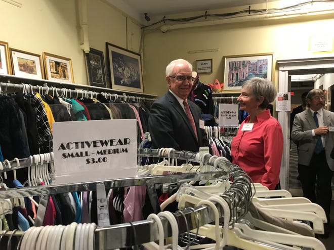 Joe MacDonough, a member of the Abby's House capital campaign steering committee, and his wife, Ellen M. MacDonough, a volunteer in the thrift store, talk at the Worcester women's shelter Wednesday. [Photo/Paula J. Owen]