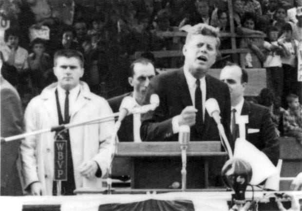 Ambridge native and former U.S. Secret Service agent Ray Zakovich can be seen to the left of President John F. Kennedy in this photo of the president's visit to downtown Aliquippa on Oct. 12, 1962. Former U.S. Rep. Eugene Atkinson provided the photo. President Donald Trump says he plans to release thousands of never-seen government documents related to President John F. Kennedy's assassination Thursday. [Submitted]