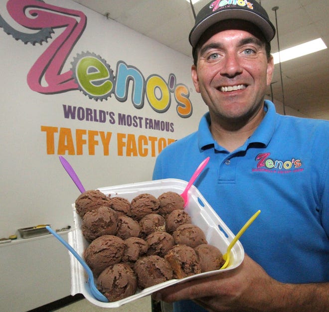 John Zeno Louizes, owner of Zeno’s World’s Most Famous Taffy Factory in the Sunshine Park Mall in South Daytona, holds a tray of peanut butter chocolate ice cream on Thursday Oct. 26, 2017. The store will celebrate National Chocolate Day on Saturday, Oct. 28, with 20 different twists on chocolate ice cream. [News-Journal/David Tucker]