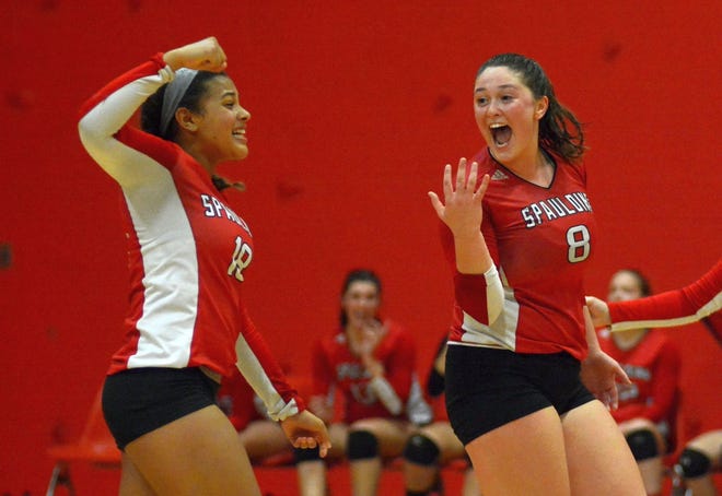Spaulding's Jalen Winfrey, left, and Hannah Douglas celebrate a point during Thursday's Division I playoff match in Rochester. [Mike Whaley/Fosters.com]