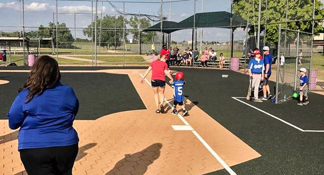 The Miracle League for special needs children and adults is now under the direction of the YMCA. The league plays at Mitch Park in Edmond. [PHOTO PROVIDED]