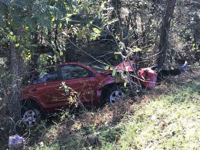 A red SUV ended up in a ravine after a head-on collision on Beaver Dam Church Road on Thursday. [Joyce Orlando/The Star]