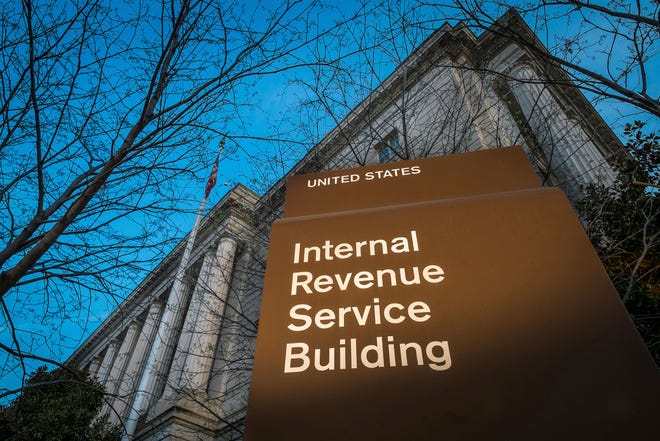 FILE -This April 13, 2014 file photo shows the headquarters of the Internal Revenue Service (IRS) in Washington. The Trump administration has settled lawsuits with dozens of tea party groups who said they received extra, often burdensome scrutiny when applying for tax-exempt status. (AP Photo/J. David Ake, File)